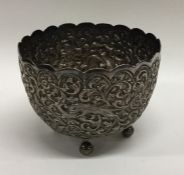 A heavy Indian cast silver sugar bowl decorated wi