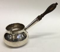 A good Georgian silver brandy pan with turned hand