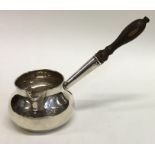 A good Georgian silver brandy pan with turned hand