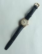 A gent's Garrard 9 carat wristwatch with silvered