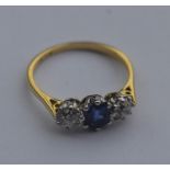 An 18 carat gold sapphire and diamond three stone