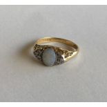 An opal and rose diamond half hoop ring in 18 cara