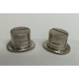 A pair of unusual silver novelty menu holders in t