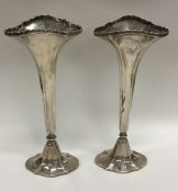 A pair of Edwardian silver tapering spill vases on