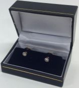 A pair of good diamond single stones mounted as dr