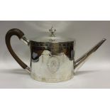 A good Georgian bright cut silver teapot decorated