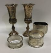 A group of silver napkin rings, spill vases etc. A