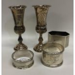 A group of silver napkin rings, spill vases etc. A