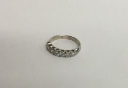 A good quality 18 carat white gold seven stone rin