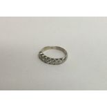 A good quality 18 carat white gold seven stone rin