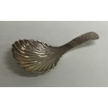 A Georgian silver bright cut caddy spoon with flut