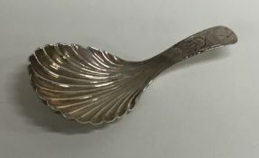 A Georgian silver bright cut caddy spoon with flut