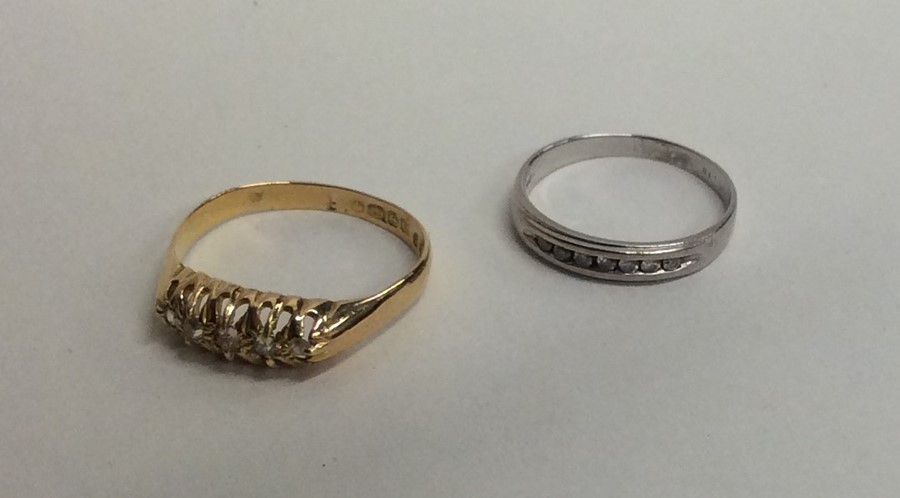 Two diamond mounted rings in 18 carat gold. Approx