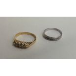 Two diamond mounted rings in 18 carat gold. Approx