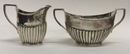 An Edwardian silver half fluted cream jug together