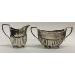 An Edwardian silver half fluted cream jug together