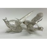 An exquisite pair of cast silver pheasants with te