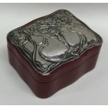 An embossed silver top jewellery casket decorated
