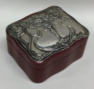 An embossed silver top jewellery casket decorated