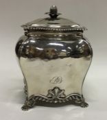 A good George III silver tea caddy on scroll feet