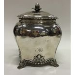 A good George III silver tea caddy on scroll feet