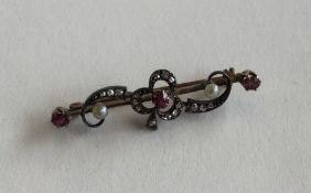 A mid-Victorian rose diamond and ruby brooch in cl