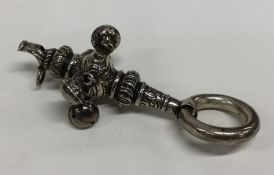 A small embossed rattle / whistle decorated with f