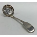 A heavy silver fiddle pattern sauce ladle. London.