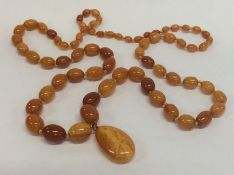 A good string of graduated yellow amber beads with