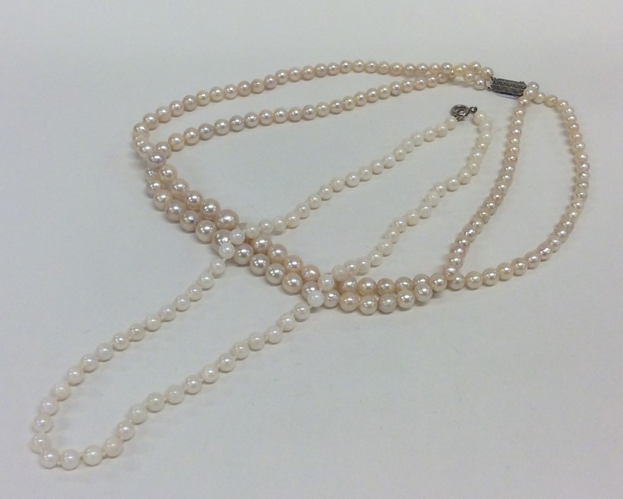 A double string of pearl beads together with one o