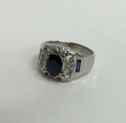 A large sapphire and diamond cluster ring in 18 ca