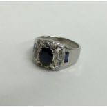 A large sapphire and diamond cluster ring in 18 ca
