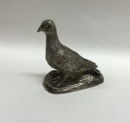 A good quality cast silver pigeon with textured bo