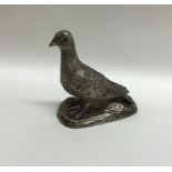 A good quality cast silver pigeon with textured bo