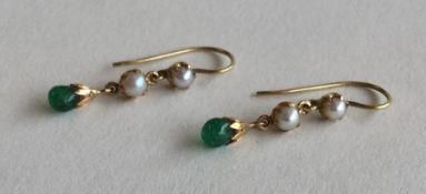 A pair of pearl and cabochon emerald drop earrings