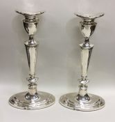 A pair of tall boat shaped Adams' style silver can