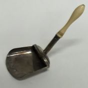 An unusual Georgian silver caddy scoop with turned