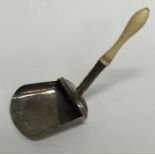 An unusual Georgian silver caddy scoop with turned