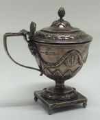 An Edwardian silver hinged top mustard decorated w