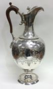 An elegant Victorian silver wine ewer attractively