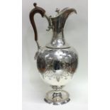 An elegant Victorian silver wine ewer attractively