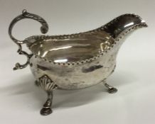 A heavy George III silver sauce boat with textured