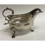 A heavy George III silver sauce boat with textured