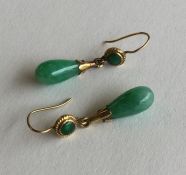 A pair of Chinese jade drop earrings with high car
