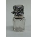 A miniature hinged top silver scent bottle and sto