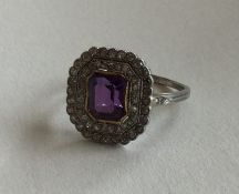 A good amethyst and diamond cluster ring with cut