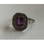 A good amethyst and diamond cluster ring with cut