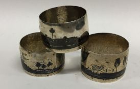 A group of three Indian silver napkin rings decora