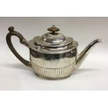 A good Georgian silver half fluted teapot with hin