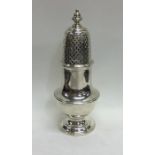 A heavy Georgian style silver caster with lift-off